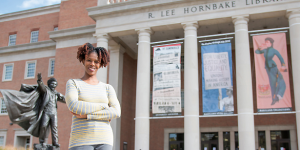 Dr. Renee Hill standing in front of the Hornbake Library building on the University of Maryland campus.